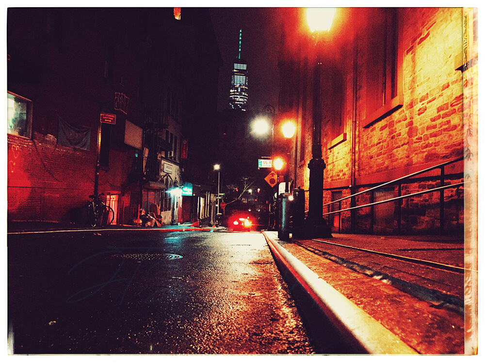 An edited photo of lower Manhattan from China Town at night titled 'Pocket Of Manhattan', which is from the City Slick collection of JTJ' White's City Series photography album